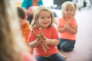 child with rhythm sticks