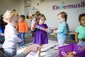 Young children playing with instruments